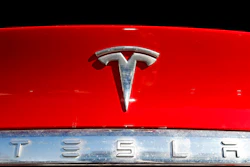 The Tesla company logo sits on a vehicle at a Tesla dealership in Littleton, Colo., on Feb. 2, 2020. The U.S. government’s road safety agency has dispatched a team to investigate the possibility that a Tesla involved in a California crash that killed three people was operating on a partially automated driving system. The National Highway Traffic Safety Administration on Wednesday, May 18, 2022 confirmed that it had sent a special crash investigation team to probe the May 12 crash on the Pacific Coast Highway in Newport Beach.