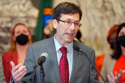 Washington Attorney General Bob Ferguson speaks March 23, 2022, at the Capitol in Olympia, Wash. Months into a complex trial over their role in flooding Washington with highly addictive painkillers, the nation's three largest opioid distributors have agreed to pay the state $518 million. Ferguson announced the deal Tuesday, May 3, 2022.