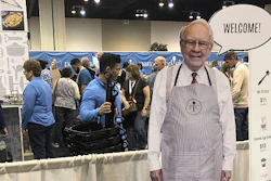 A cutout of Berkshire Hathaway CEO Warren Buffett greets shareholders at the Pampered Chef booth at the company's annual meeting, Friday, APril 29, 2022, in Omaha, Neb.. Tens of thousands of shareholders are expected Saturday to attend the company's first in-person meeting since the pandemic began.