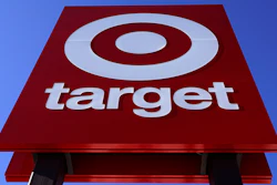 The bullseye logo on a sign outside a Target store is seen on Feb. 28, 2022. Target's first-quarter profit took a big hit from higher costs, despite strong sales growth. Target's results Wednesday, May 18, reflect the pressure on retailers' profits coming from surging inflation and persistent clogs in the supply chain.