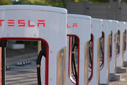 This April 22, 2021, photo shows a Tesla Supercharger station in Buford, Ga. Tesla proposed a three-for-one split of its stock on Friday, June 10, 2022, a move that will make a single share of the electric car maker more accessible to investors but not affect the company's overall market value.