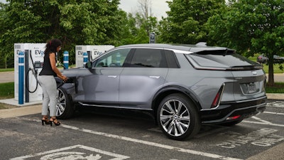 Cadillac LYRIQ charging at EVgo fast charging station.