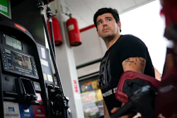 Wallace Reid fuels his vehicle he drives to make a living using ride-share apps, Wednesday, June 22, 2022, in the Queens borough of New York. Millions of Americans who rely on their cars for work are changing their habits, signing up for carpools or even ditching their cars for bicycles as gas prices recently hit $5 per gallon for the first time ever.