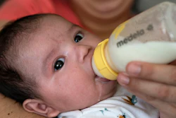 Two-month-old Jose Ismael Gálvez is fed a bottle of formula by his mother, Yury Navas, 29, of Laurel, Md., from her dwindling supply of formula at their apartment in Laurel, Md., Monday, May 23, 2022.