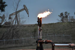 A flare to burn methane from oil production is seen on a well pad near Watford City, N.D., on Aug. 26, 2021. The U.S. government this week is holding its first onshore oil and gas sales from public lands since President Joe Biden took office.