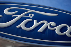 This Oct. 24, 2021 file photo shows a Ford company logo on a sign at a Ford dealership in southeast Denver. Ford is recalling over 2.9 million vehicles in the U.S., Wednesday, June 15, 2022, to fix a transmission problem that can increase the risk of inadvertent rollaway crashes. The recall covers certain 2013 to 2019 Escape, 2013 to 2018 C-Max, 2013 to 2016 Fusion, 2013 to 2021 Transit Connect, and 2015 to 2018 Edge vehicles.