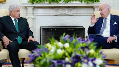 President Joe Biden speaks as he meets with Mexican President Andrés Manuel López Obrador in the Oval Office of the White House in Washington, Tuesday, July 12, 2022.