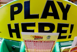 A Mega Millions playslip for those players preferring to choose the numbers they want to play is among the stacks of other lottery game playslips displayed at a Smoker Friendly store in Cranberry Township, Pa., Friday, Jan. 22, 2021.