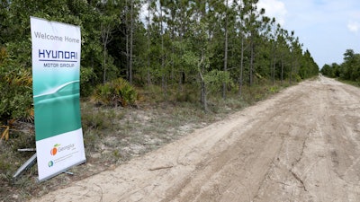 A banner welcomes Hyundai Motor Group to their future home at the Bryan County mega-site in Ellabell, Ga., Friday, May 20, 2022. Georgia officials are close to finalizing a deal with the automaker to build a $5.5 billion electric car plant near Savannah, Ga. An economic development agency representing four Savannah-area counties approved its portions of the agreement Tuesday, July 19, 2022, including an economic incentives package.