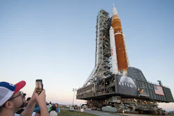 Invited guests and NASA employees take photos as NASA's Space Launch System (SLS) rocket with the Orion spacecraft aboard is rolled out of High Bay 3 of the Vehicle Assembly Building for the first time, at the Kennedy Space Center in Cape Canaveral, Fla., Thursday, March 17, 2022. On Wednesday, July 20, 2022, the 53rd anniversary of the Apollo 11 moon landing, NASA said it’s shooting for a late August test launch of its giant, new moon rocket.