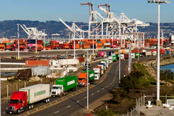 Trucks line up to enter a shipping terminal at the Port of Oakland, Oakland, Calif., Nov. 10, 2021.