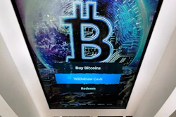 The Bitcoin logo appears on the display screen of a cryptocurrency ATM in Salem, N.H., Feb. 9, 2021.