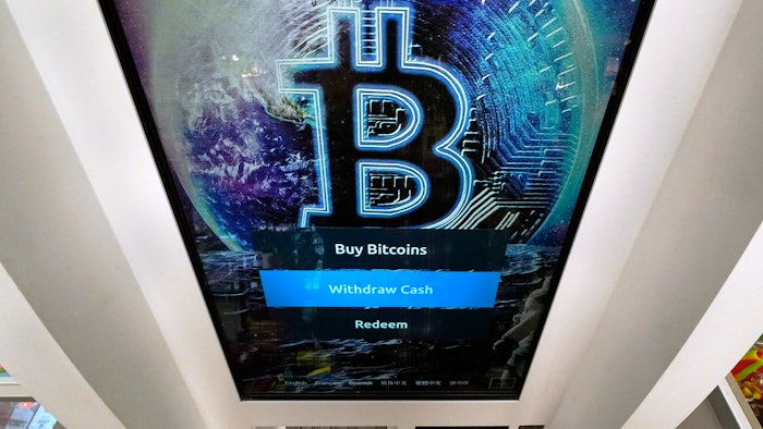 The Bitcoin logo is seen on the display screen of a cryptocurrency ATM in Salem, NH on February 9, 2021.