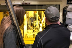In this Nov. 29, 2018 photo, hot cell operators Dawnette Hunter, left, and Scot White manipulate radioactive material from behind 4-foot-thick leaded glass at the Hot Fuel Examination Facility at the Idaho National Laboratory about 50 miles west of Idaho Falls, Idaho. The U.S. Department of Energy has selected Idaho as the site for a proposed nuclear test reactor that would dramatically reduce the time needed to develop nuclear fuels and components for a new generation of nuclear reactors. The Energy Department on Wednesday, July 27, 2022, said it selected its 890-square-mile site in eastern Idaho that includes the Idaho National Laboratory to build the Versatile Test Reactor, or VTR.
