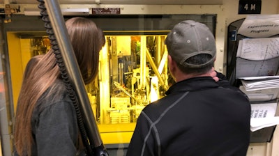 In this Nov. 29, 2018 photo, hot cell operators Dawnette Hunter, left, and Scot White manipulate radioactive material from behind 4-foot-thick leaded glass at the Hot Fuel Examination Facility at the Idaho National Laboratory about 50 miles west of Idaho Falls, Idaho. The U.S. Department of Energy has selected Idaho as the site for a proposed nuclear test reactor that would dramatically reduce the time needed to develop nuclear fuels and components for a new generation of nuclear reactors. The Energy Department on Wednesday, July 27, 2022, said it selected its 890-square-mile site in eastern Idaho that includes the Idaho National Laboratory to build the Versatile Test Reactor, or VTR.