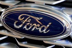 A Ford logo is seen on the grill of a car on display at the Pittsburgh Auto Show, Feb. 15, 2018. Ford Motor Co.'s net income rose 19% in the second quarter of 2022 as the company pulled together enough computer chips to boost factory output and sales. The Dearborn, Mich., automaker said Wednesday, July 27, 2022, it made $667 million from April through June.