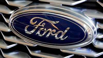 A Ford logo is seen on the grill of a car on display at the Pittsburgh Auto Show, Feb. 15, 2018. Ford Motor Co.'s net income rose 19% in the second quarter of 2022 as the company pulled together enough computer chips to boost factory output and sales. The Dearborn, Mich., automaker said Wednesday, July 27, 2022, it made $667 million from April through June.