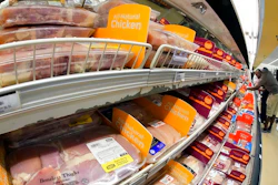 Chicken is on display in a market in Pittsburgh, July 12, 2022. The Justice Department is expected to file a lawsuit and proposed settlement against some of the largest poultry producers in the U.S. It's part of an effort to end what the government claims have been longstanding deceptive and abusive practices for workers.