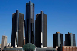 This May 12, 2020, file photo, shows a general view of the Renaissance Center, headquarters for General Motors, along the Detroit skyline from the Detroit River. General Motors will keep its headquarters in its seven-building office tower complex in downtown Detroit, its CEO says. Mary Barra, in an interview with The Associated Press, says the automaker’s main office will remain in the Renaissance Center, the centerpiece of the city’s skyline just across the Detroit River from Canada.