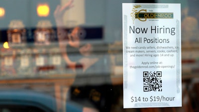 Sign advertising for help at The Goldenrod restaurant and candy shop, York Beach, Maine, June 1, 2022.