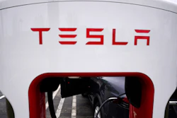 Tesla Supercharger is seen at Willow Festival shopping plaza parking lot in Northbrook, Ill., on May 5, 2022. Tesla shareholders on Thursday, Aug. 4, 2022 approved a three-for-one stock split, a move that will make the company's shares more accessible to smaller investors.