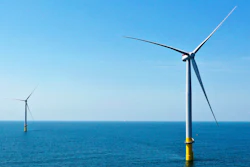 Two of the offshore wind turbines which have been constructed off the coast of Virginia Beach, Va. are viewed June 29, 2020. State regulators on Friday, Aug. 5, 2022, approved an application from Dominion Energy Virginia to build an enormous offshore wind farm off the coast of Virginia Beach and recover the cost from ratepayers.