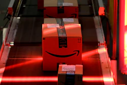 Packages riding on a belt are scanned to be loaded onto delivery trucks at the Amazon Fulfillment center in Robbinsville Township, N.J., on Aug. 1, 2017.