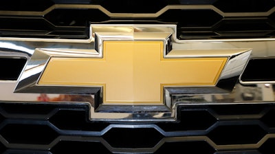 The Chevrolet logo is displayed at the 2020 Pittsburgh International Auto Show Thursday, Feb.13, 2020 in Pittsburgh. General Motors is recalling more than 484,000 large SUVs in the U.S., Tuesday, Aug. 16, 2022, to fix a problem that can cause the third-row seat belts to malfunction. The recall covers Chevrolet Suburbans and Tahoes, Cadillac Escalades and GMC Yukons from 2021 and 2022.