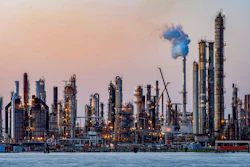 The sun sets at Chalmette refinery in Chalmette, La., located just over the Mississippi River levee May 3, 2020. While the Inflation Reduction Act concentrates on clean energy incentives that could drastically reduce overall U.S. emissions, it also buoys oil and gas interests by mandating leasing of vast areas of public lands and off the nation’s coasts.