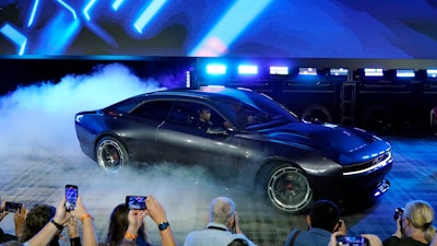 The Dodge Charger Daytona SRT concept is unveiled, Wednesday, Aug. 17, 2022, in Pontiac, Mich. Thundering gas-powered muscle cars will be closing in on their final Saturday night cruises in the coming years as automakers begin replacing them with super-fast cars that run on batteries.