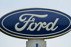 A Ford logo is seen on signage at Country Ford in Graham, N.C., Tuesday, July 27, 2021. Ford Motor Co. is cutting about 3,000 white-collar workers as it moves reduce costs and make the transition from internal combustion to electric vehicles, leaders of the Dearborn, Mich., automaker announced Monday, Aug. 22, 2022, in a companywide email.