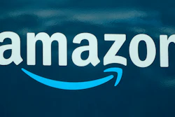 An Amazon logo appears on a delivery van, Oct. 1, 2020, in Boston. Amazon is shutting down the hybrid virtual, in-home care service it’s spent years developing. The service, called Amazon Care, will end by Dec. 31, 2022.