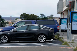 Cars are parked at an electric charging station in San Francisco, Thursday, Aug. 25, 2022. California is poised to required 100% of new cars, trucks and SUVs sold in the state to be powered by electricity or hydrogen by 2035.