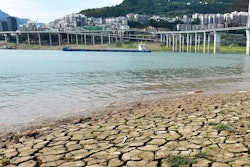 A dried riverbed is exposed after the water level dropped in the Yangtze River in Yunyang county in southwest China's Chongqing Municipality, Tuesday, Aug. 16, 2022. Unusually high temperatures and a prolonged drought are affecting large swaths of China, reducing crop yields and drinking water supplies.