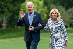 President Joe Biden with first lady Jill Biden waves as they walk on the South Lawn of the White House in Washington, upon arrival from a trip to visit flood affected areas in Kentucky, Monday, Aug. 8, 2022.