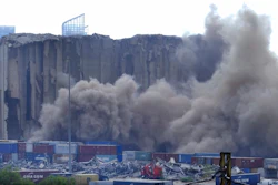 A section of Beirut's massive port grain silos, shredded in the 2020 explosion, collapsed on Sunday after a weekslong fire triggered by grains that had fermented and ignited in the summer heat.