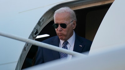President Joe Biden steps from Air Force One as he and first lady Jill Biden arrive at Delaware Air National Guard Base in New Castle, Del., Tuesday, Sept. 13, 2022, to travel to Wilmington, Del.
