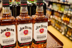 Shelves display bottles of bourbons for sale at a Pennsylvania fine wine and spirits store, Saturday, Jan. 22, 2022, in Harmony, Pa.