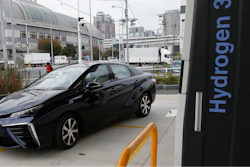 A Toyota Motor Corp.'s new hydrogen fuel cell vehicle Mirai arrives at a charge station near Toyota's showroom on Nov. 17, 2014, in Tokyo.