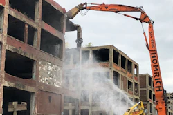 A demolition claw begins razing part of the long-vacant Packard auto plant on Thursday, Sept. 29, 2022, in Detroit.
