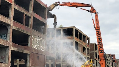 A demolition claw begins razing part of the long-vacant Packard auto plant on Thursday, Sept. 29, 2022, in Detroit.
