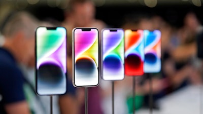 New iPhone 14 models on display at an Apple event on the campus of Apple's headquarters in Cupertino, Calif., Sept. 7, 2022. Apple Inc. will manufacture its latest iPhone 14 in India, the company said on Monday, as it seeks to curb its production in China.