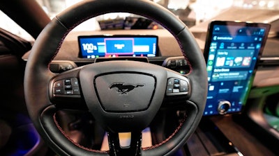 The cockpit of a Ford Mustang Mach-E electric car is pictured at the Motor Show in Essen, Germany, Thursday, Dec. 2, 2021