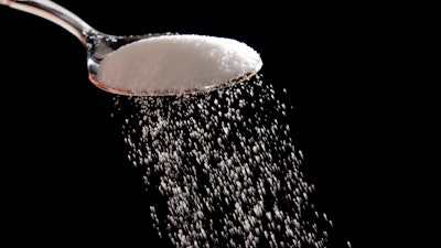 Granulated sugar is poured in Philadelphia, Sept. 12, 2016. A federal judge has rejected the Justice Department's bid to block a major U.S. sugar manufacturer from acquiring its rival, clearing the way for the acquisition to proceed. The ruling, handed down Friday, Sept. 23, 2022, by a federal judge in Wilmington, Del., comes months after the Justice Department sued to try to halt the deal between U.S. Sugar and Imperial Sugar Company, one of the largest sugar refiners in the nation.