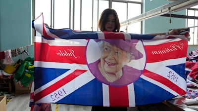 Ninety minutes after Queen Elizabeth II died, orders for thousands of British flags started to flood into the factory south of Shanghai.