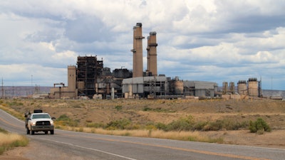 A work truck leaves the San Juan Generating Station near Waterflow, New Mexico, on Tuesday, Sept. 20, 2022.