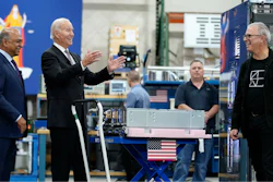 President Joe Biden speaks as he looks at IBM chips, mainframes and memory cards during a tour of an IBM facility with IBM Chairman and CEO Arvind Krishna, left, in Poughkeepsie, N.Y., on Thursday Oct. 6, 2022.