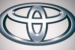 A logo of Toyota Motor Corp. at a dealer Wednesday, May 11, 2022, in Tokyo. In a Tuesday, Oct. 12, 2022, statement, Toyota Motor Corp. says it has begun assembling autos in Myanmar after a more than yearlong delay following a military takeover in February 2021.