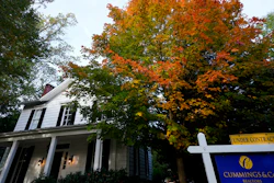 A real estate sign is seen near a home on the market in Towson, Md., Oct. 12, 2022.