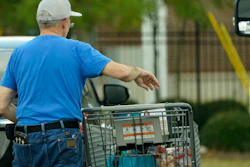 A shopper removes purchases from his cart in Jackson, Miss., Oct. 12, 2022.